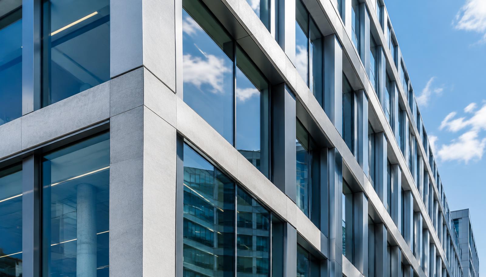 Modern glass and steel office building facade in daylight
